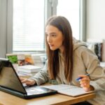 woman works at laptop