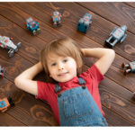 Child with toy robots