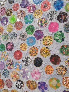 a collage made of lots of tiny circles of shiny material
