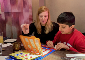 woman and young boy using PECS to communicate